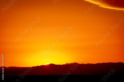 Sun Disappears Into The Mountains Of Mexico In Big Bend