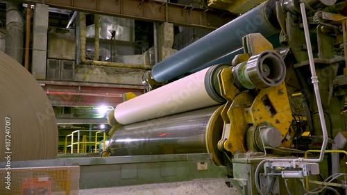 Cardboard making machine. Releasing a cardboard roll from the machine