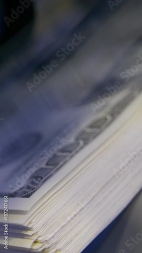 Defocused money counting process with hundred dollar banknotes