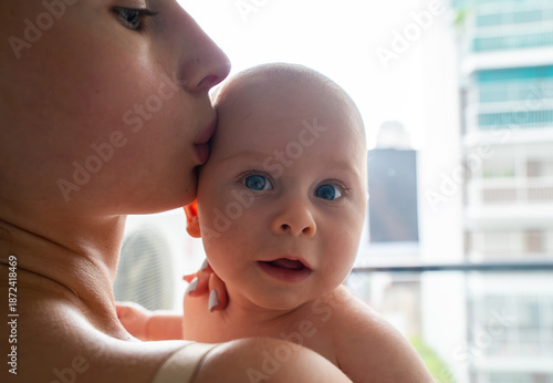 A woman is holding a baby