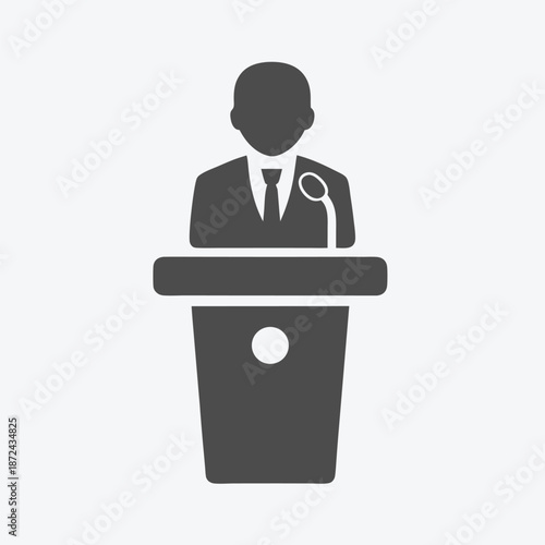 Gray faceless figure at podium gives speech via microphone on white background