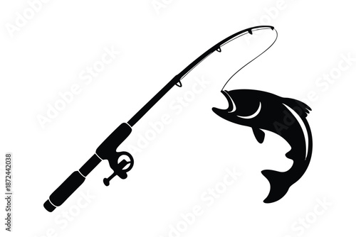 A jumping fish is caught with fishing rod, creating water ripples in silhouette