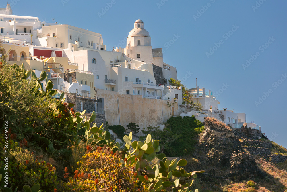 Fototapeta premium White cliffside buildings and churches in Fira, Santorini, Greece