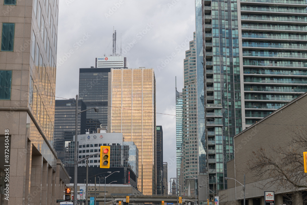 Obraz premium looking north on Bay St from Harbour St to buildings in the financial district, condo towers, Toronto
