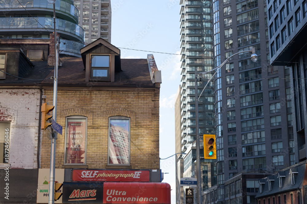 Naklejka premium heritage building facade and sign of Ultra Convenience (and Self-photograph-ie) located at 568 Yonge St (built 1876) intersection of Wellesley St W, Toronto