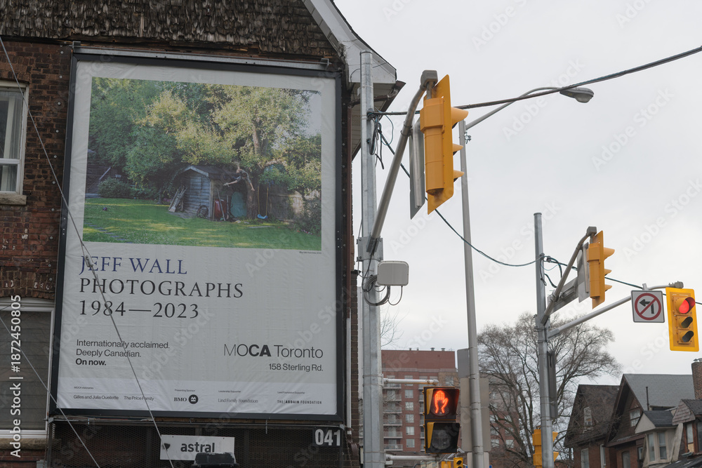 Obraz premium roadside billboard advertisement for a Jeff Wall exhibition at MOCA spotted at northeast corner of Perth Ave & Bloor St W in Toronto (Lucky Convenience Convenience