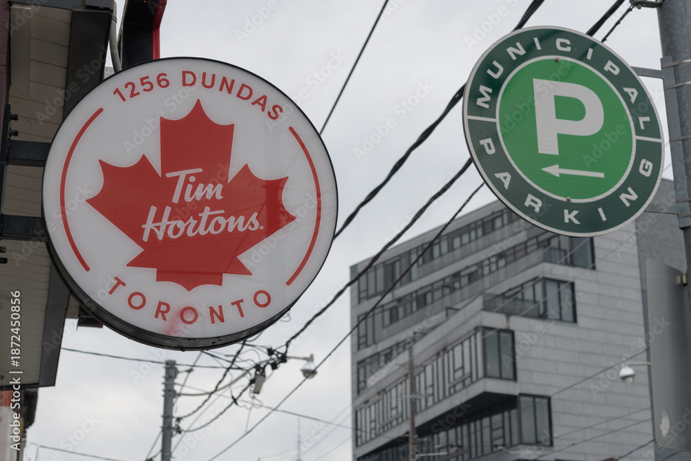 Naklejka premium two round projecting signs: Tim Hortons at 1256 Dundas St W and Municipal Parking, Toronto