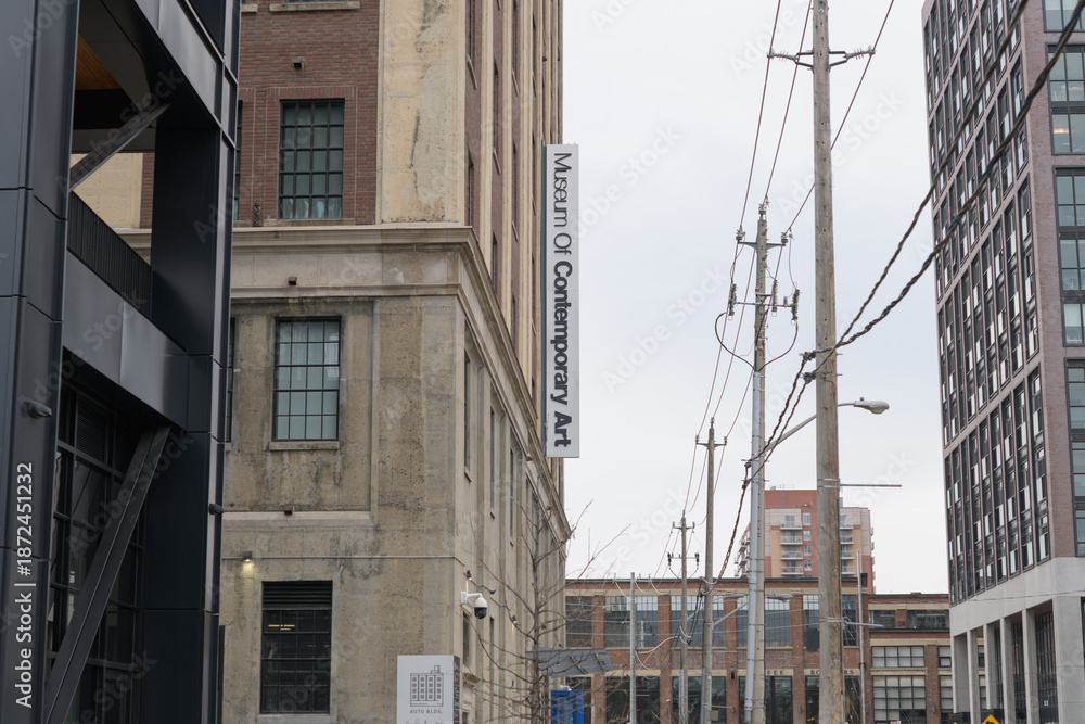 Naklejka premium exterior projecting sign outside The Museum of Contemporary Art Toronto Canada (MOCA), located at 158 Sterling Rd, a repurposed former automobile manufacturing building