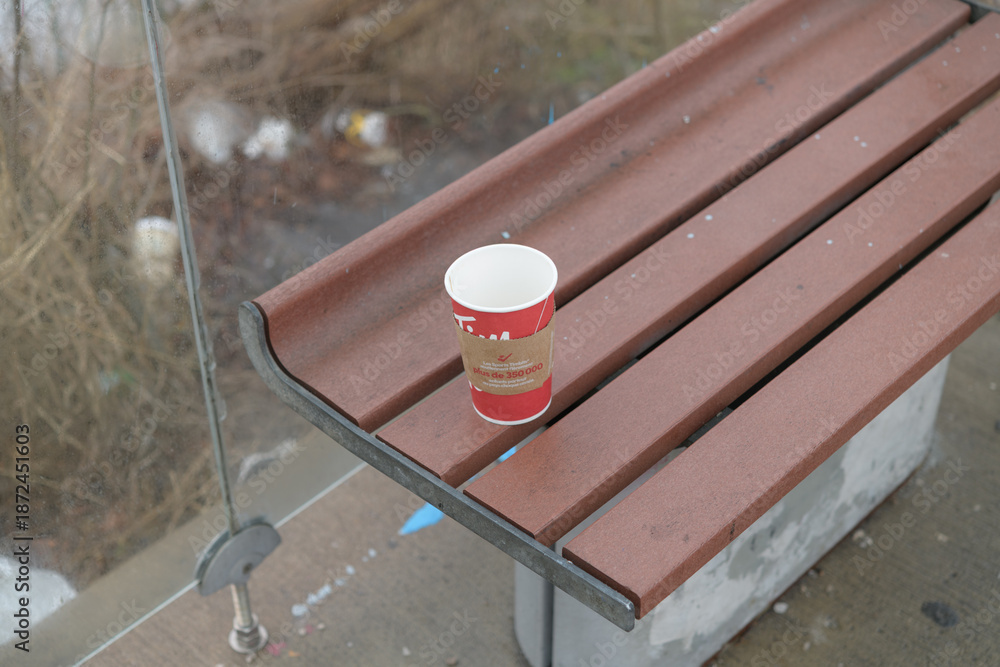 Obraz premium discarded Tim Hortons beverage cup inside a bus shelter seat, Toronto