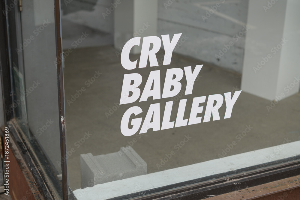 Fototapeta premium sign at Cry Baby Gallery, a cocktail bar, located at 1468 Dundas St W, Toronto