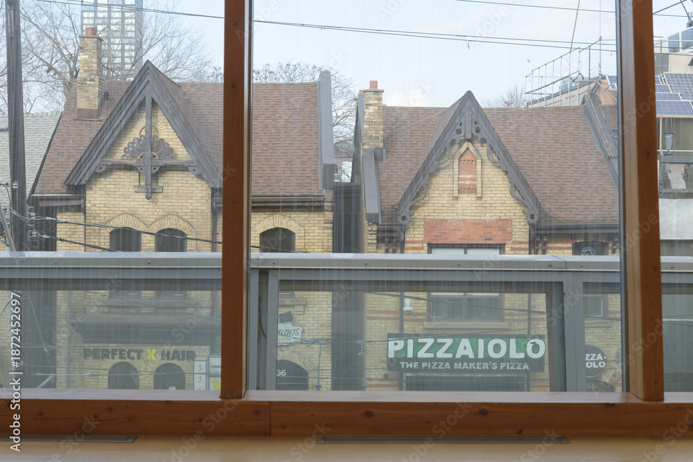 Naklejka premium view of heritage properties across the street from the Art Gallery of Ontario, including Pizzaiolo, viewed from inside Galleria Italia, Toronto