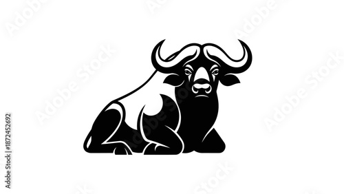 Powerful Buffalo Bull Resting with Large Horns in Bold Black and White.