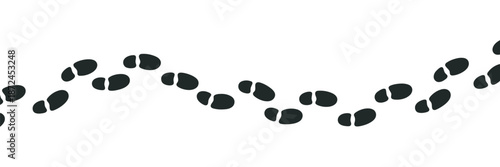 Winding path of human footprints symbolizing progress, exploration, adventure, and the journey of life