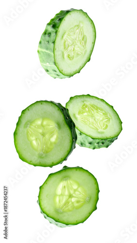 Fresh green raw cucumber slices falling on transparent background