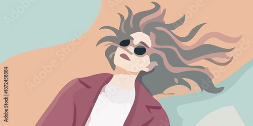 Stylish woman with flowing hair and trendy sunglasses