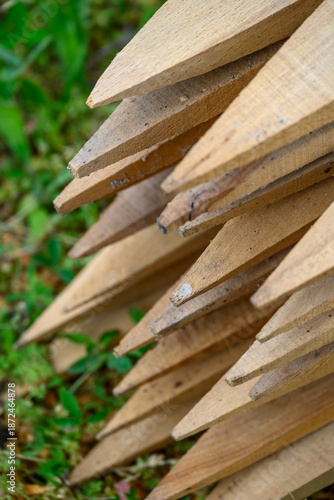 Bild auf Leinwand Stack of pointed wooden stakes