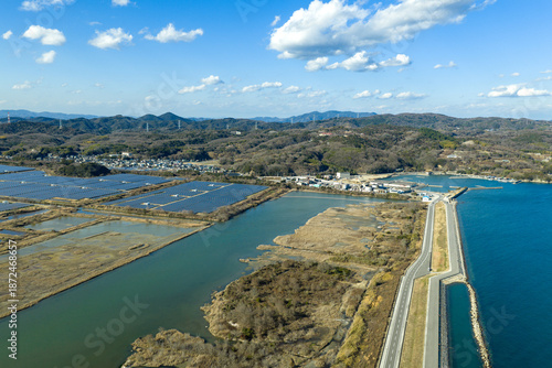 Winter aerial view of Setouchi Kirei Solar Power Plant and salt field ruins in Ushimado, Japan.