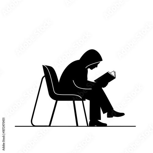 Man Sitting on Chair Reading Book.