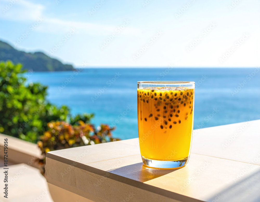 Fototapeta premium Indulge in fresh passion fruit juice on a sunlit terrace overlooking a tropical ocean. This vibrant shot captures summer relaxation and luxury travel, perfect for hospitality and wellness ads.
