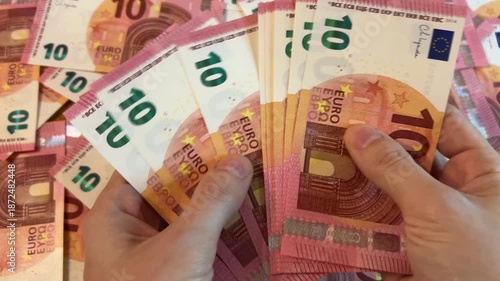 Counting euro banknotes. Female hands count 10 euros cash. Investments, family budget and savings concept	