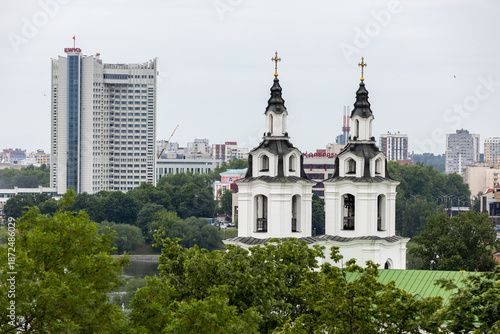 Belarus. Minsk. Top view of the Cathedral of the Descent of the Holy Spirit and modern skyscrapers.