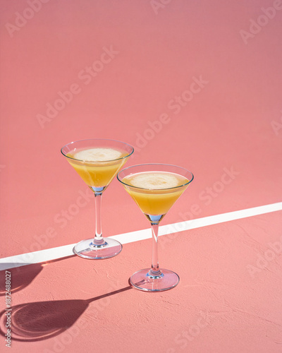 Elements of a tennis court and a cocktail party aesthetic. The overall concept plays on themes of retro sport, premium leisure, and a tennis and martini lifestyle
