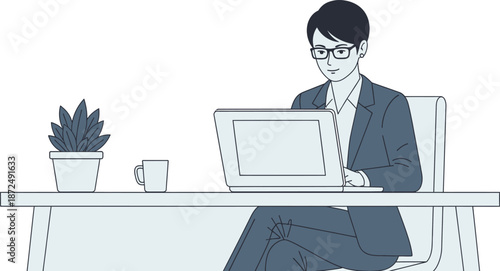 Professional young business woman working diligently on her laptop computer at a clean desk in a modern office environment