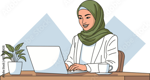 Smiling Muslim woman wearing a green hijab happily works on her laptop at a wooden desk with a plant and coffee cup