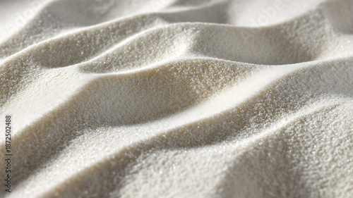 White sand in macro view, fine bright grains with subtle shadows and sparkling highlights, gentle ripples formed by the wind creating soft natural patterns, pure minimal and serene atmosphere.