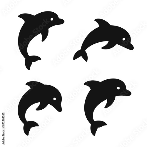 Silhouette of four dolphins on a dark background