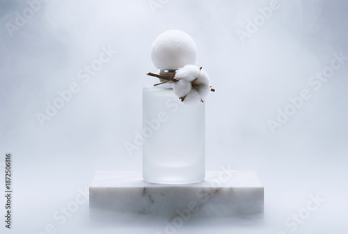 Cotton perfume stands in the fog on a white marble stone