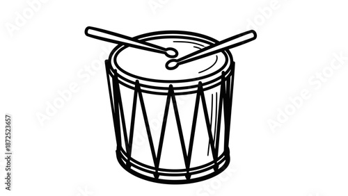 Drum with drumsticks on top closeup.