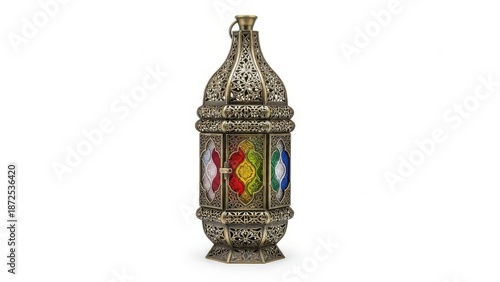 An ornate antique metallic fanoos lantern, displaying intricate craftsmanship and vibrant stained glass panels, is captured in a detailed studio shot, isolated on a clean white background.