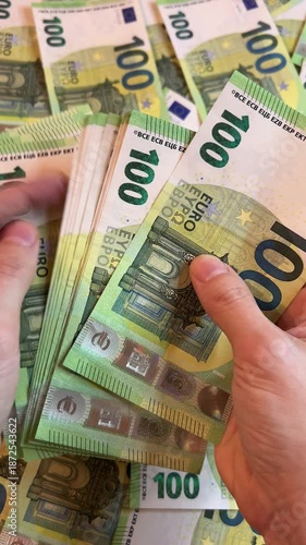 Counting euro banknotes. Female hands count 100 euros cash. Investments, family budget and savings concept