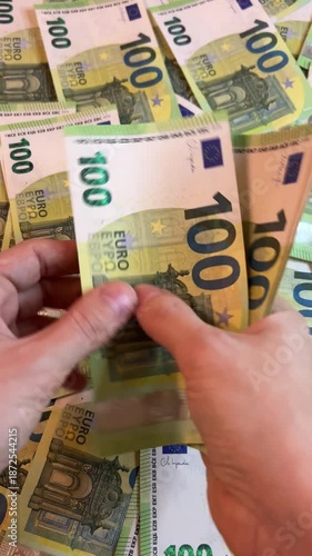 Counting euro banknotes. Female hands count 100 euros cash. Investments, family budget and savings concept