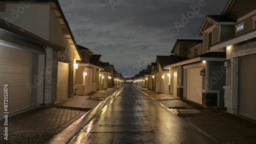 Εκτύπωση καμβά Quiet residential street at night featuring back views of American houses and large garage doors