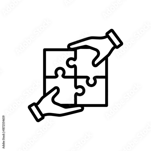 Hands Assembling Jigsaw Puzzle Pieces Together.
