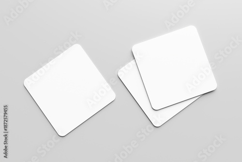 Blank white square business card mockup, placed on a gray background. Flat lay, top view, open composition.