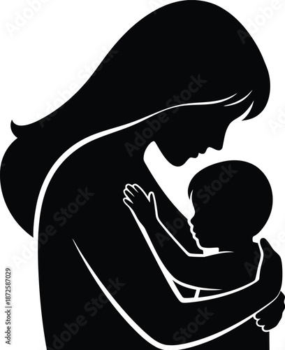 Silhouette of mother holding baby in her arms motherhood love