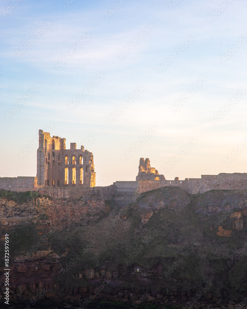 Obraz premium Tynemouth Priory and Castle, in strong low winter sunshine, January 2026