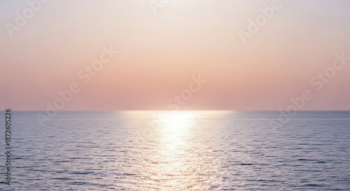 Tranquil ocean horizon bathed in soft sunlight against a pastel sky backdrop