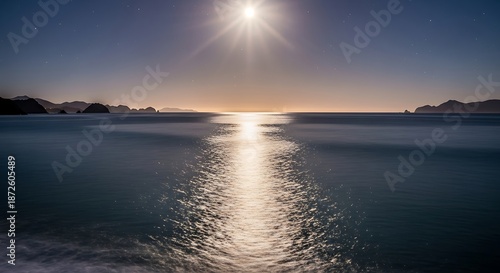 Tranquil ocean scene illuminated by bright sunlight horizon over water