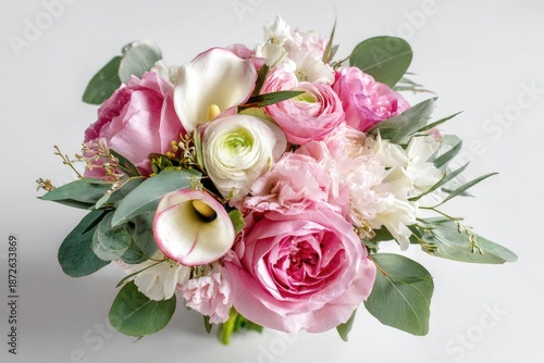Lush bouquet of pink, white, and green flowers, artfully arranged on a white background