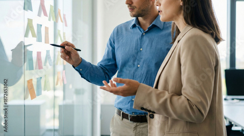 Business Professionals Collaborating on Agile Strategy with Sticky Notes