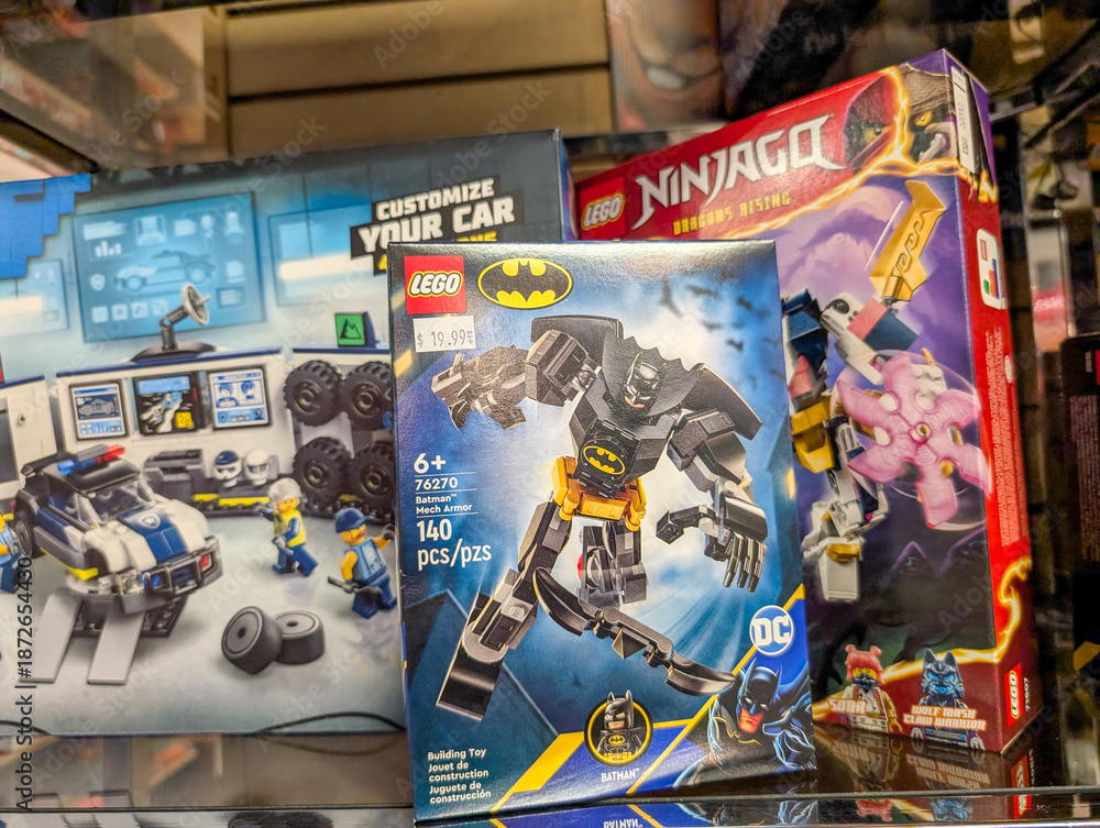Fototapeta premium Canada, Quebec, 08 November 2025 : Colorful boxes of Batman Ninjago Lego sets displayed in store shelf