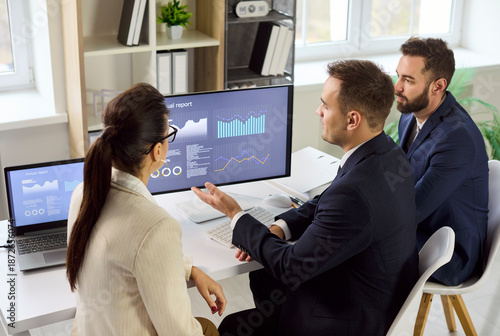 Valokuva Business analysts meeting finance analytics dashboard report