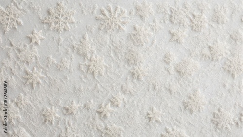 Abstract background with delicate pastel colored snowflake and flower patterns on a textured white surface.