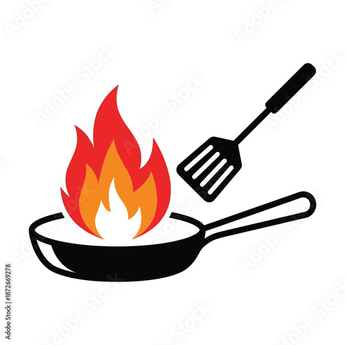 Burning food in a frying pan with a spatula nearby a dangerous cooking scenario