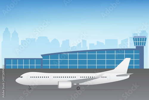 Airport with an airplane on the runway, control tower under a clear blue sky