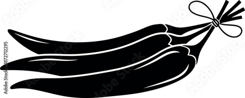 Silhouette of three black peppers tied together